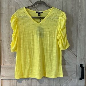 Women’s yellow knit top. New with tags.  Size large